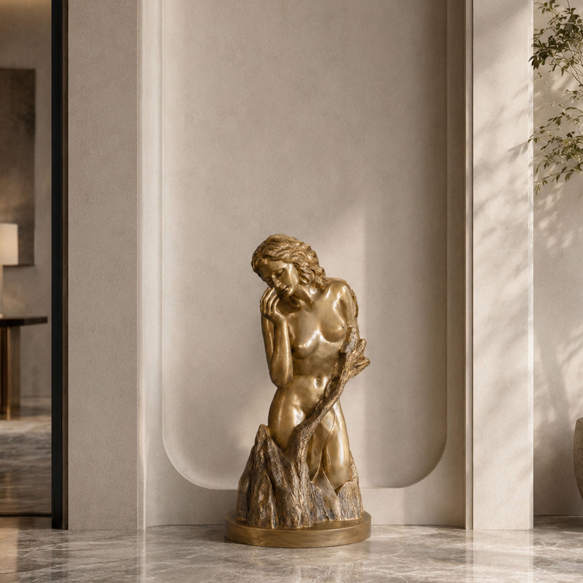 Bronze female figurative sculpture with introspective pose and antique gold finish displayed in a luxury minimalist interior space.