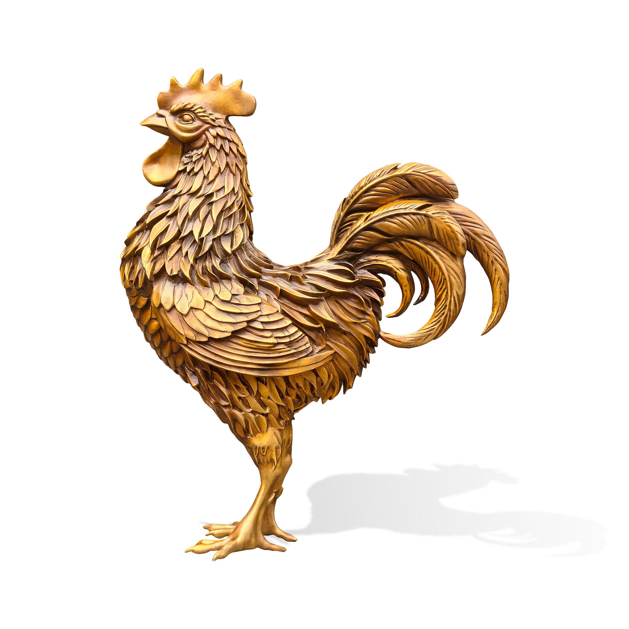 Side profile view of a golden bronze zodiac rooster statue with raised comb, flowing tail feathers, layered body plumage, detailed claws, and Chinese zodiac symbolism on a white background.