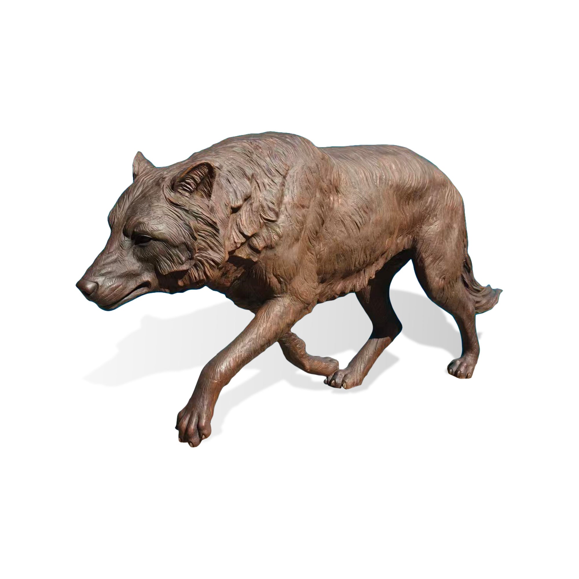 Side view of a realistic walking wolf bronze statue with finely sculpted fur, natural movement pose, detailed paws, and premium wildlife sculpture craftsmanship.