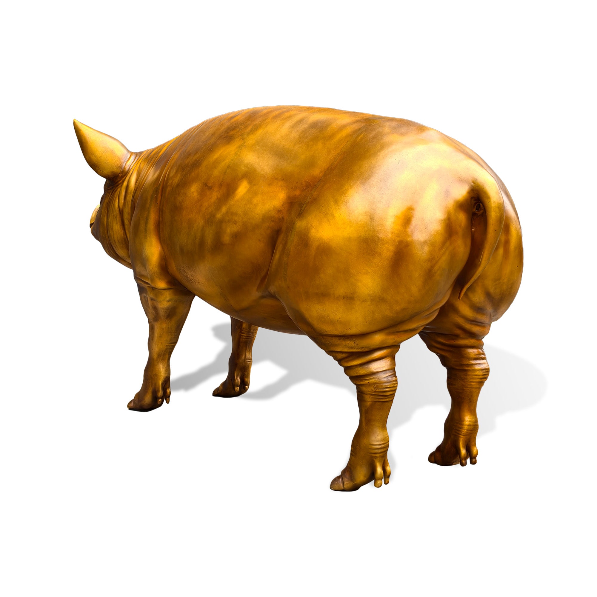 Side view of a golden bronze wild boar sculpture featuring a smooth polished finish, realistic animal form, detailed legs, and contemporary outdoor art design.
