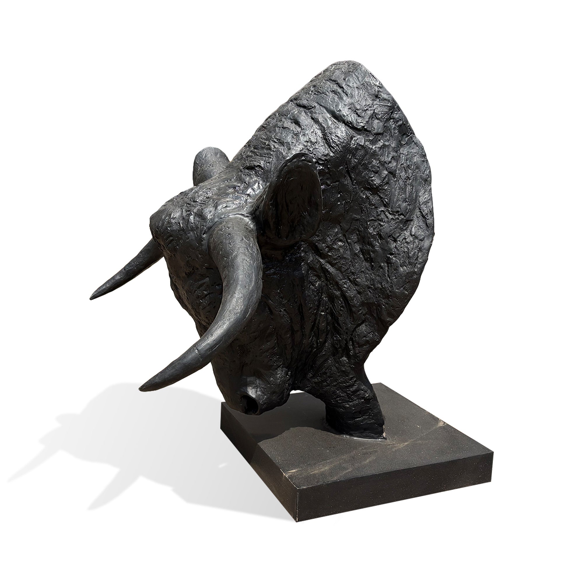 Three-quarter view of modern black bull head sculpture on a square pedestal, highlighting realistic horn shapes and handcrafted metal sculpture details.