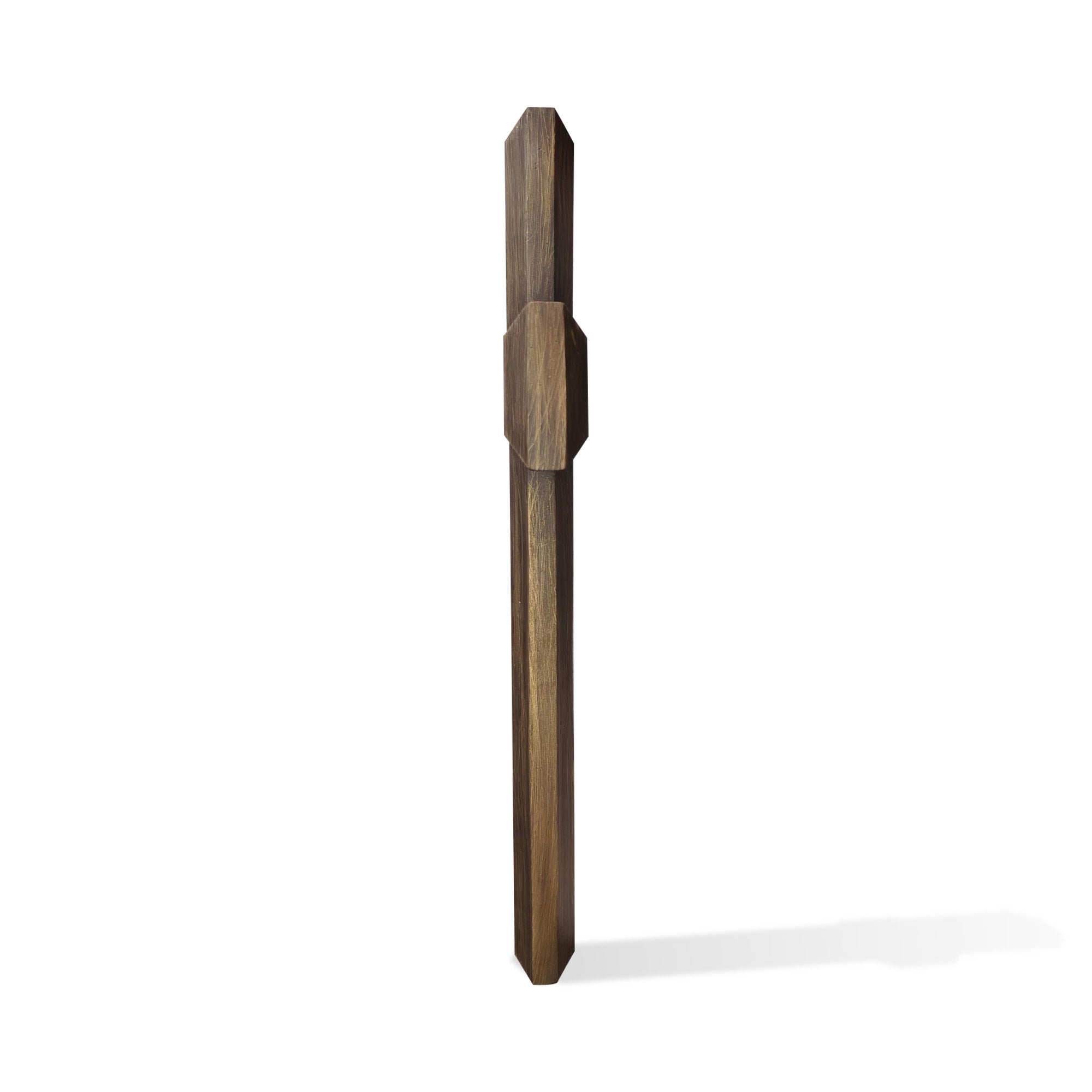 Side view of a modern bronze cross monument sculpture showing its solid geometric structure, refined edges and handcrafted antique bronze finish for outdoor display.