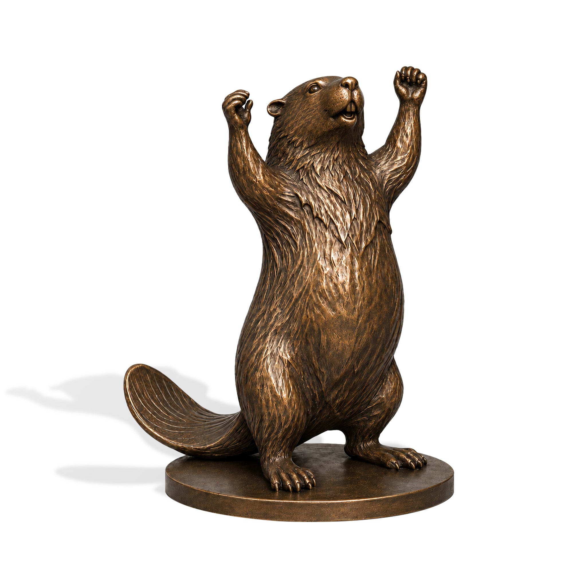 Bronze beaver sculpture standing upright with raised paws and a detailed flat tail, displayed beside a lake near a waterfront home in warm evening light