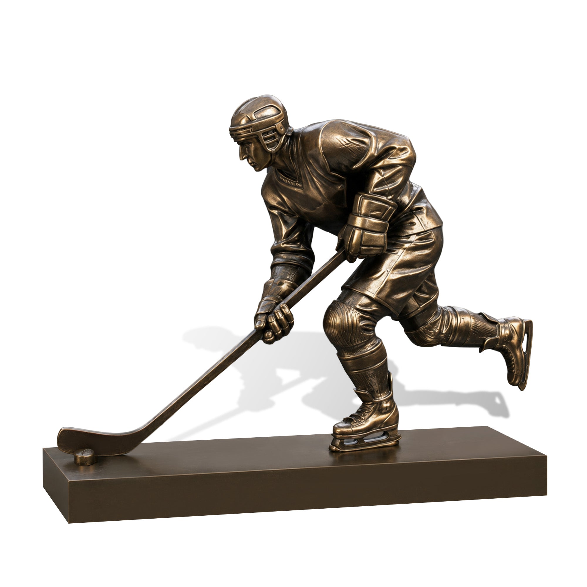 Detailed bronze hockey player statue featuring a helmet, gloves, padded uniform, skates, hockey stick and puck in a dynamic forward skating pose on a rectangular base.