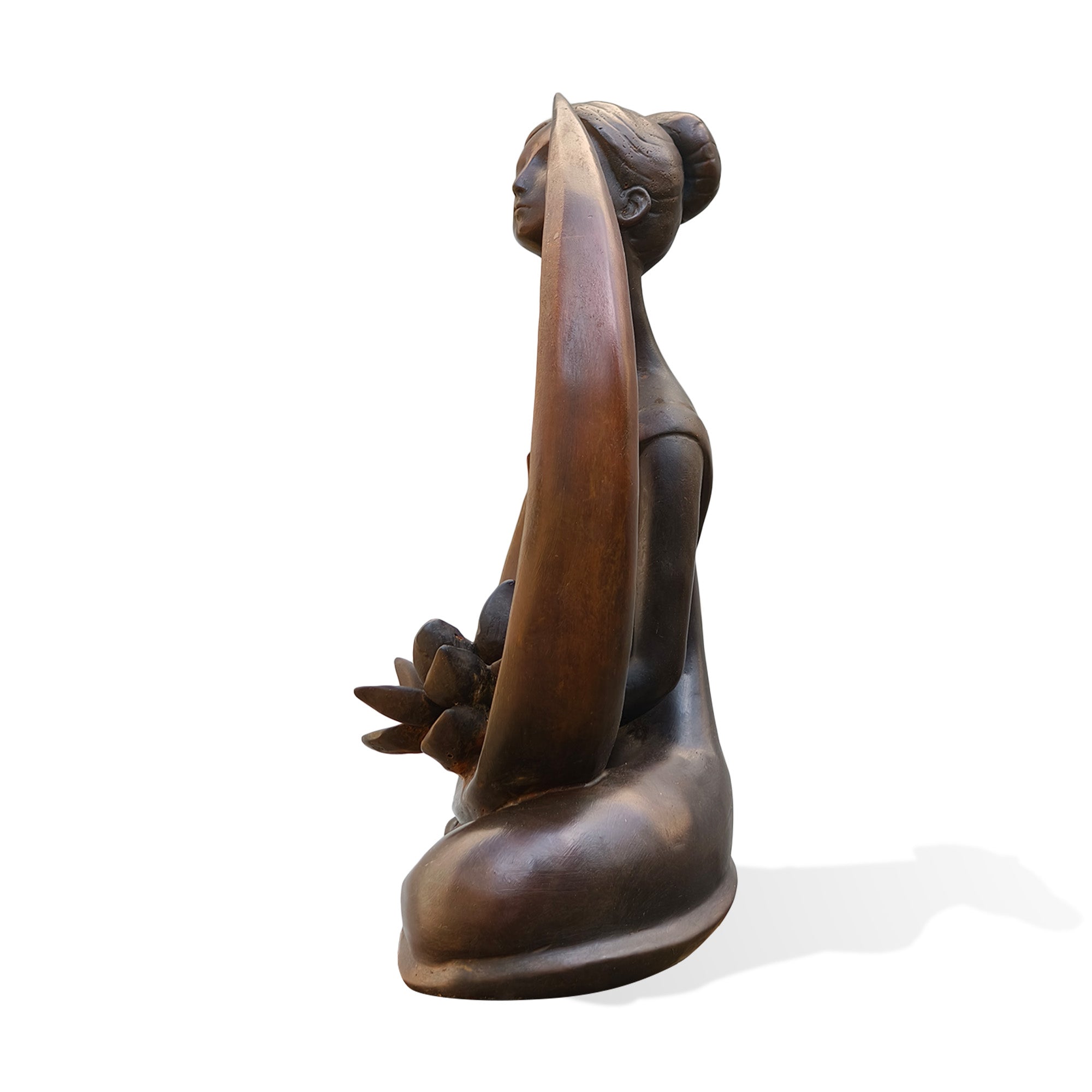 Side view of a bronze female lotus sculpture featuring a serene seated woman, flowing abstract curves, lotus flower details, and a warm antique bronze finish.