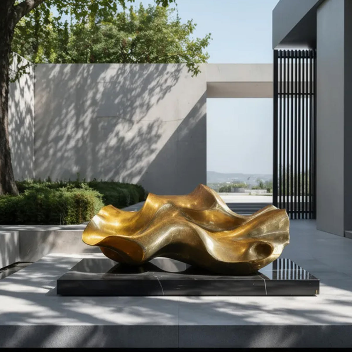 Abstract bronze garden sculpture with flowing organic design installed in a modern luxury courtyard landscape