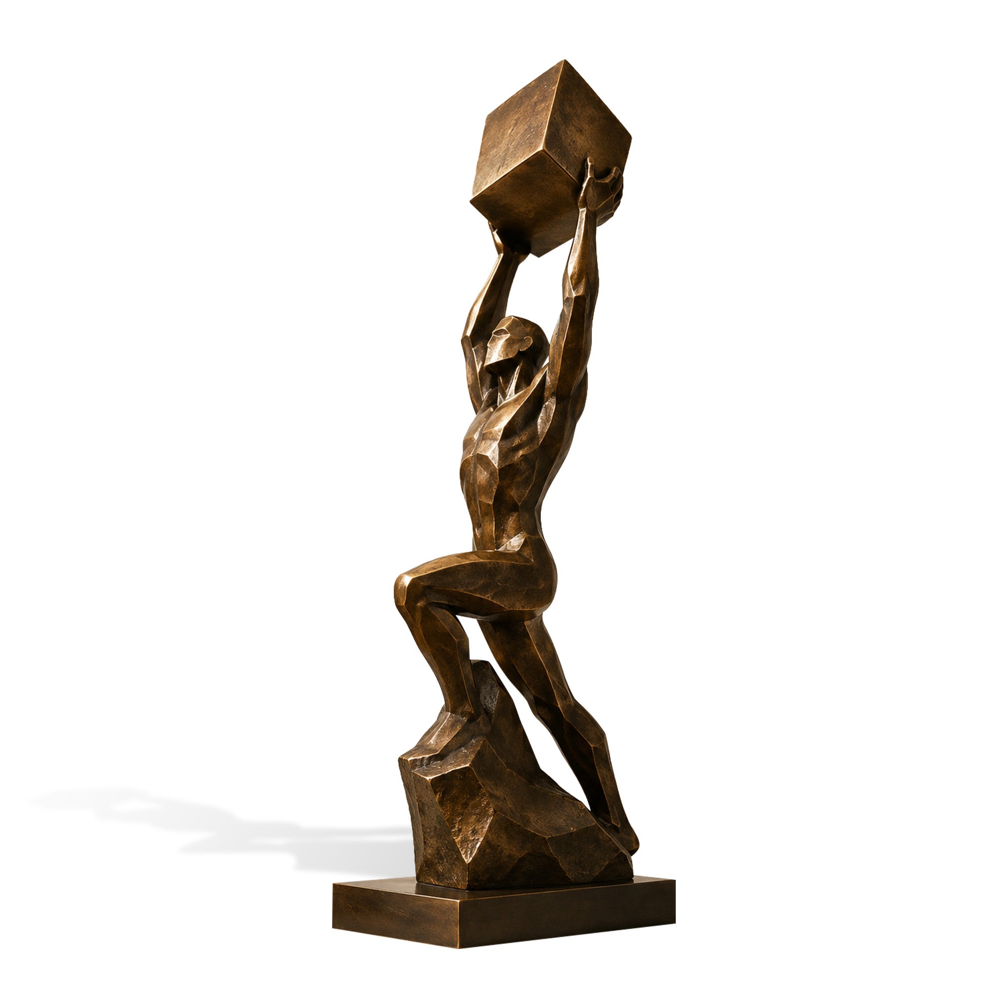 Monumental abstract bronze athlete sculpture installed on a stone pedestal in a modern urban plaza, featuring a male figure raising a geometric cube overhead, dynamic climbing posture, angular faceted body, sculptural rock base, and warm antique bronze finish.