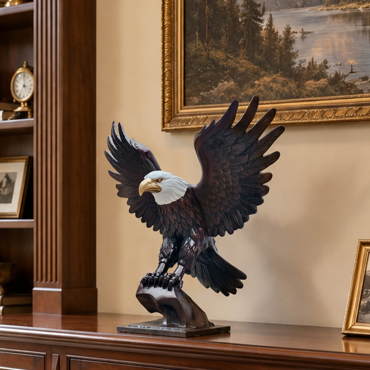 Bronze bald eagle sculpture with spread wings displayed as luxury interior decor on a wooden cabinet