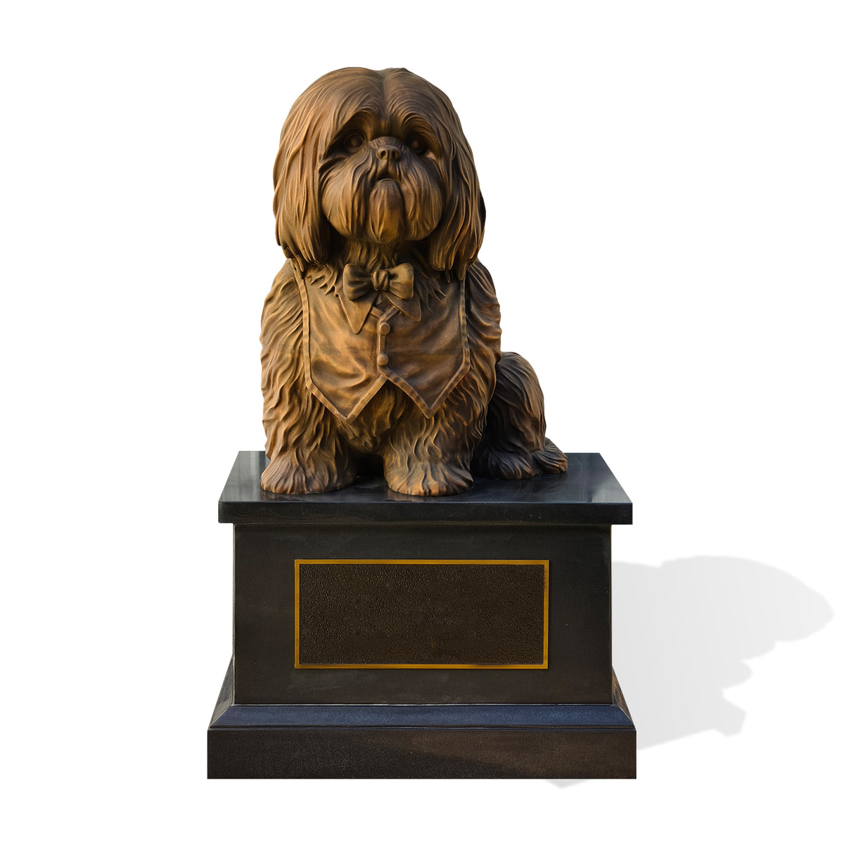 A bronze-finished dog statue of a Shih Tzu wearing a bow tie and vest, mounted on a black rectangular memorial-style base with a gold border and blank plaque area, shown on a white background.