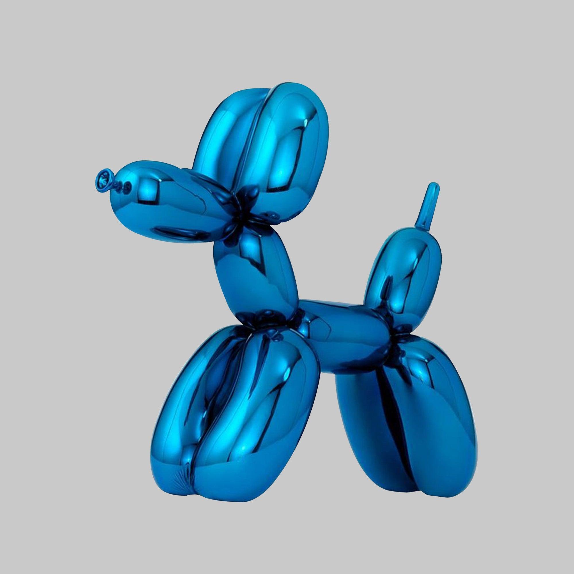 blue balloon dog fiberglass sculpture displaying on the bookshelf