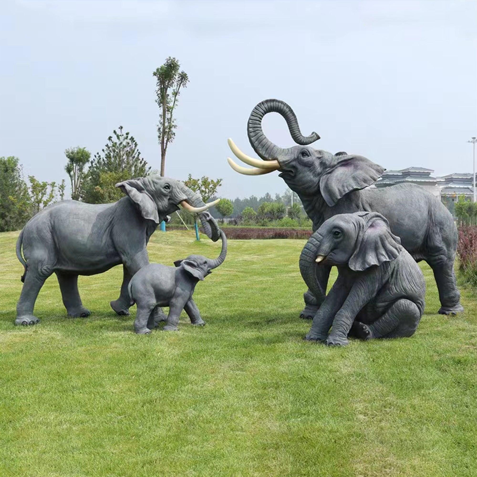 elephant family fiberglass sculpture parents and two elephant babies playing in garden