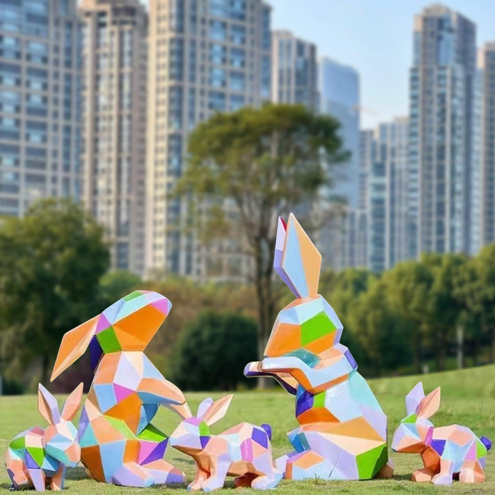 large outdoor sculpture clourful rabbit family on the lawn