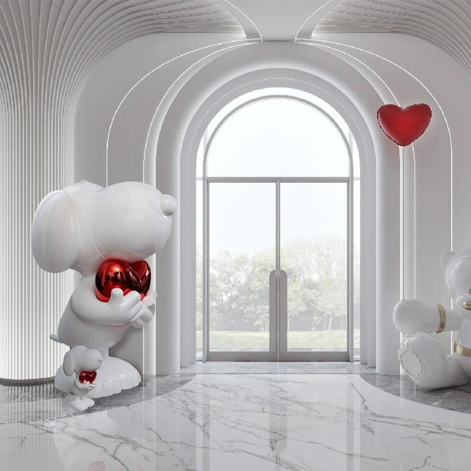 white carton snoopy holding red heart resin sculpture in indoor lobby