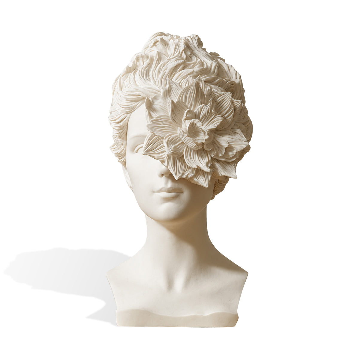 Front view of a matte ivory fiberglass female bust featuring a large flower with deeply textured petals covering one eye and extending into voluminous wavy hair. Smooth facial features, an elongated neck and angular shoulders contrast with the detailed floral surface against a white background.