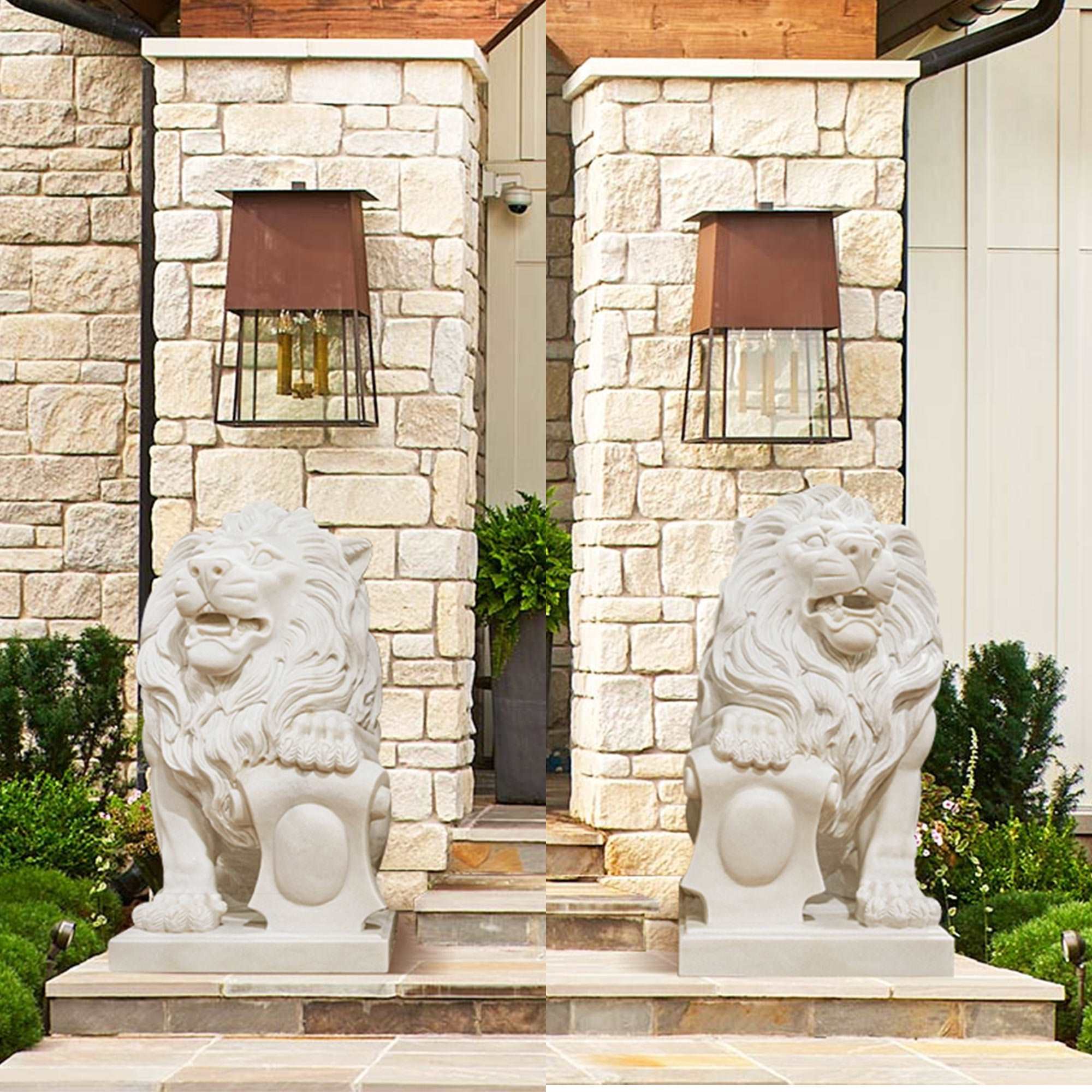 pair marble sitting lion statue infront of the villa