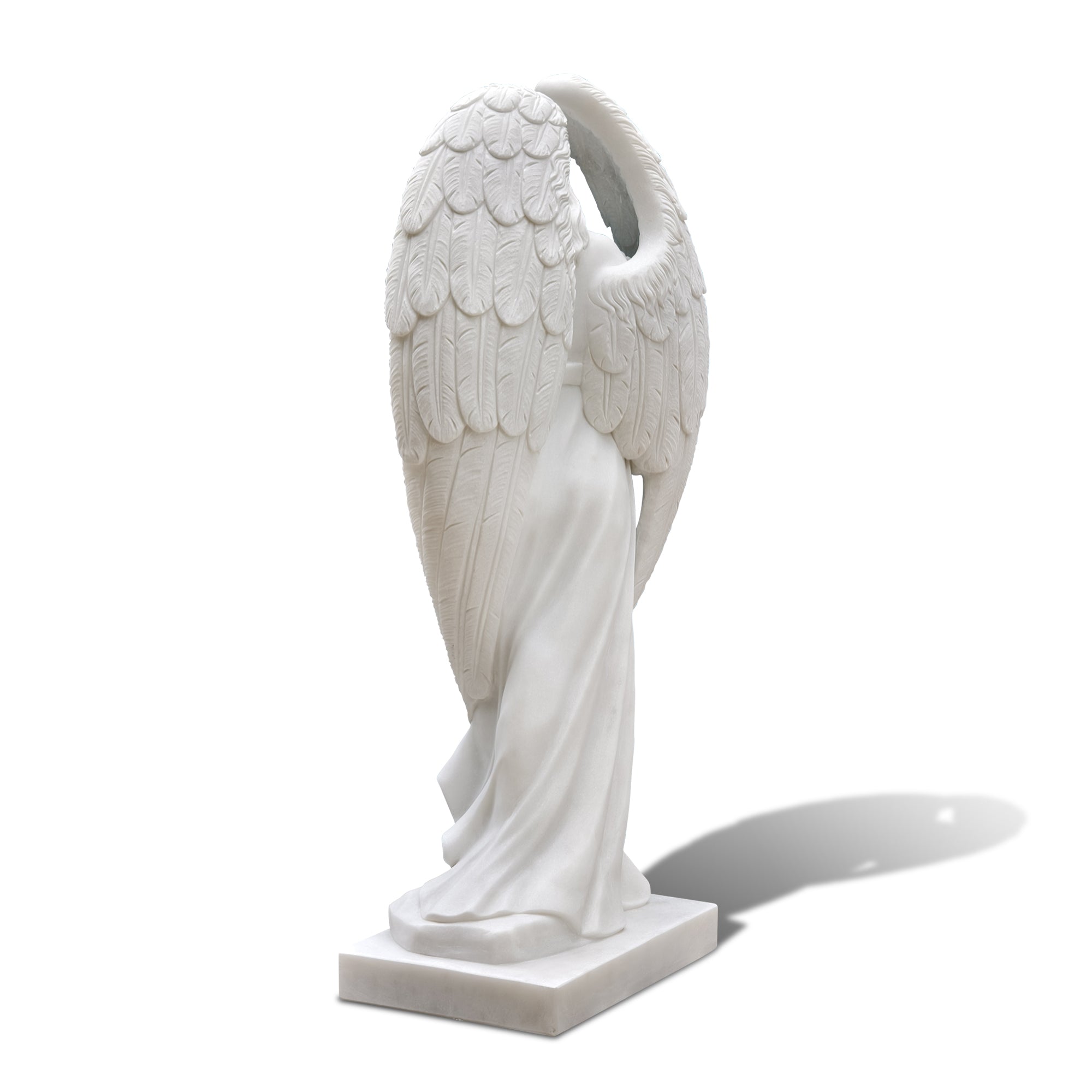 detailed close-up of angel sculpture wings carved in marble
