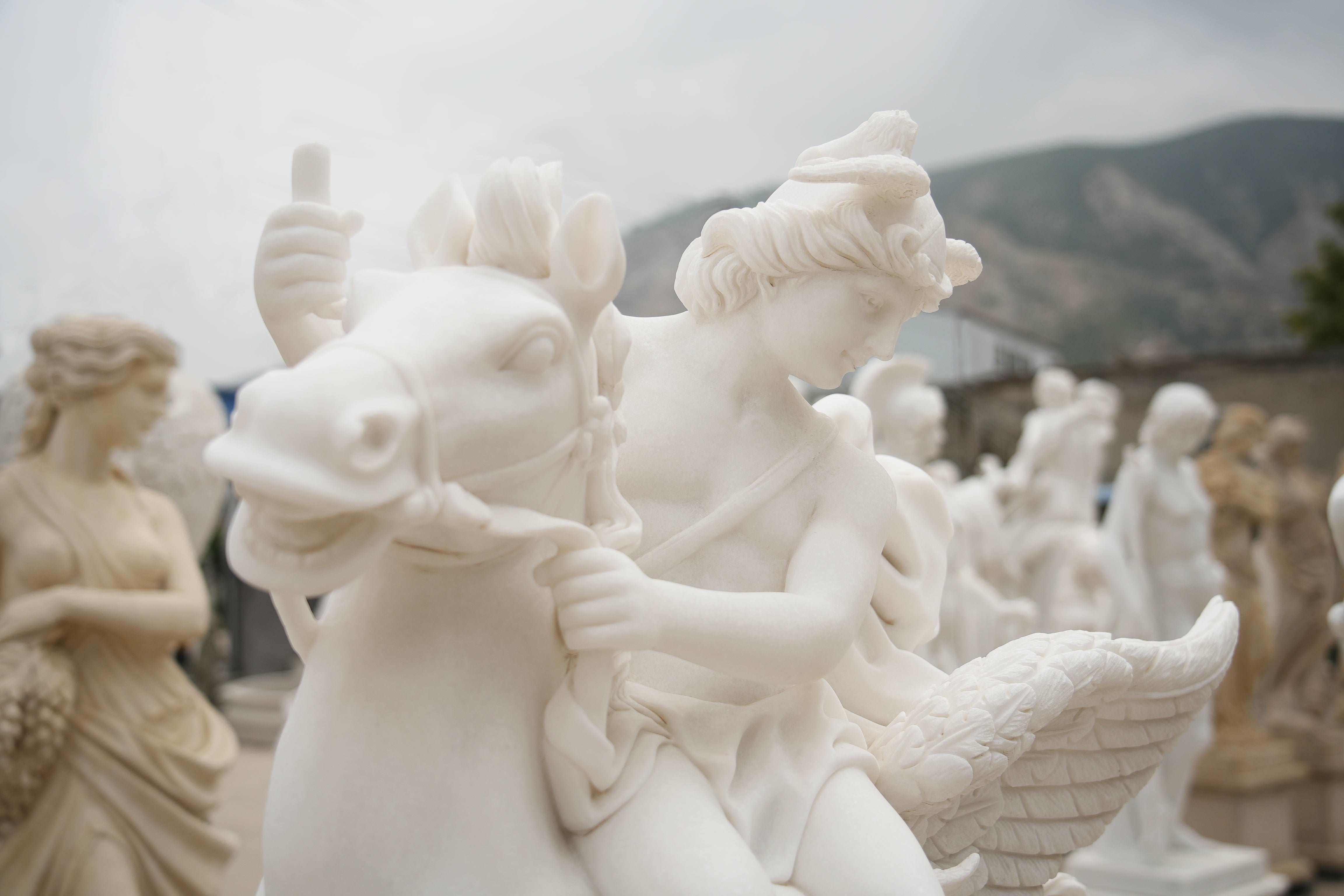 close up of White Marble Pegasus Rider Sculpture