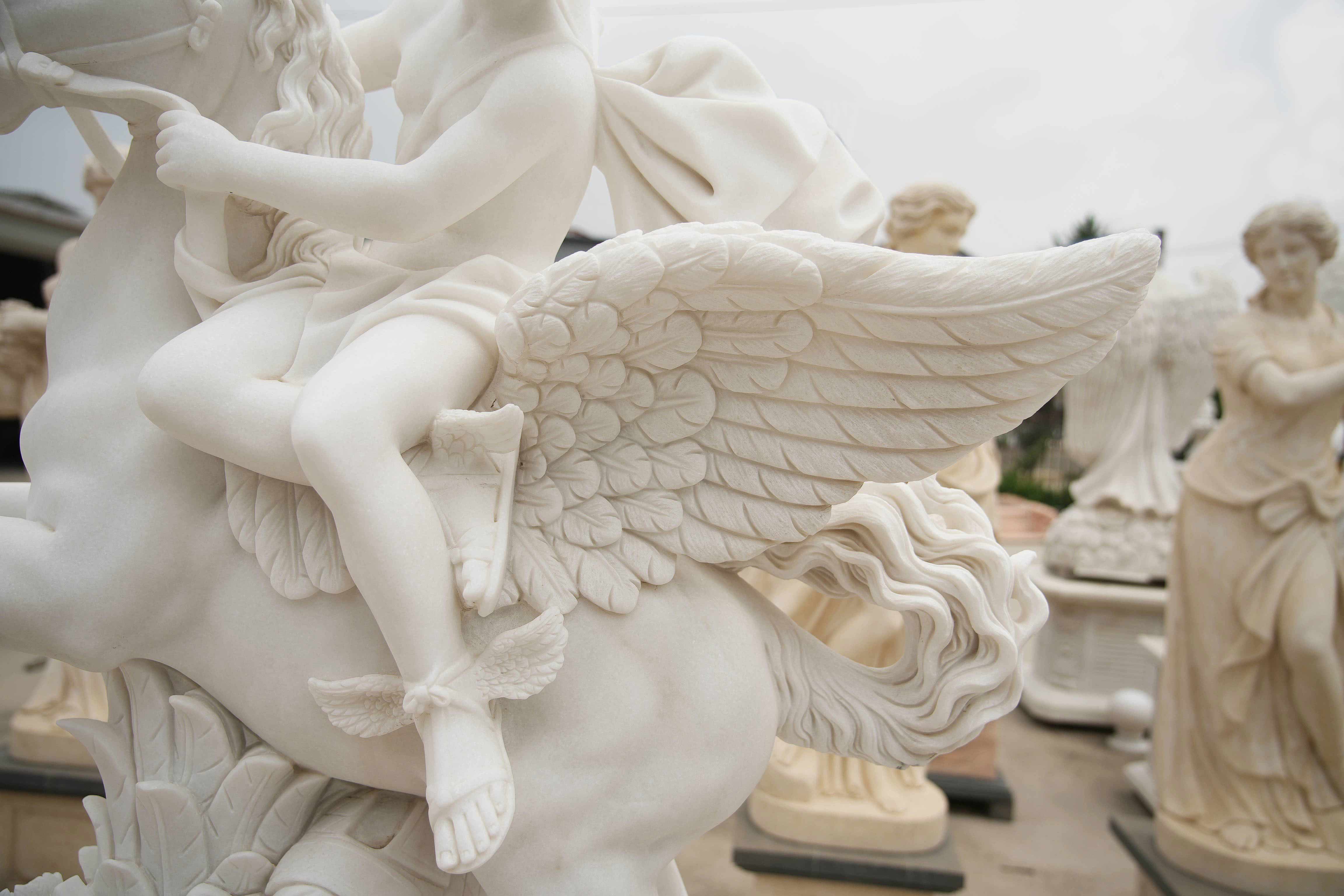 close up of White Marble Pegasus Rider Sculpture