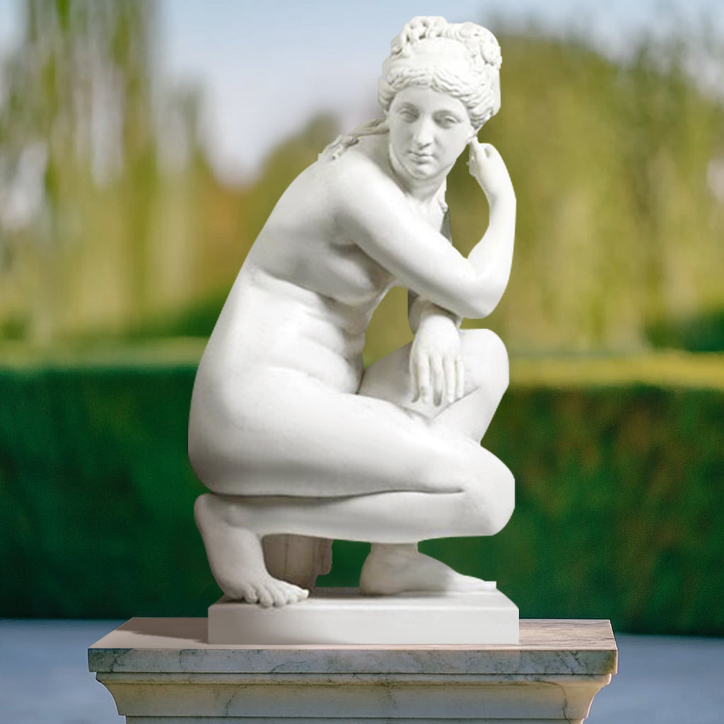 Marble Aphrodite Crouching Venus Statue, display in outdoor garden.