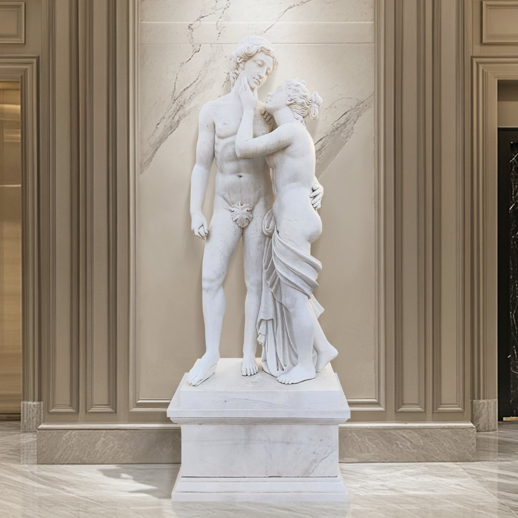 Adam and Eve sculpture in polished white marble with pedestal, representing the Biblical creation story, display indoor