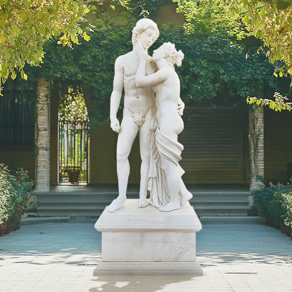 Adam and Eve sculpture in polished white marble with pedestal, representing the Biblical creation story, display outdoor garden