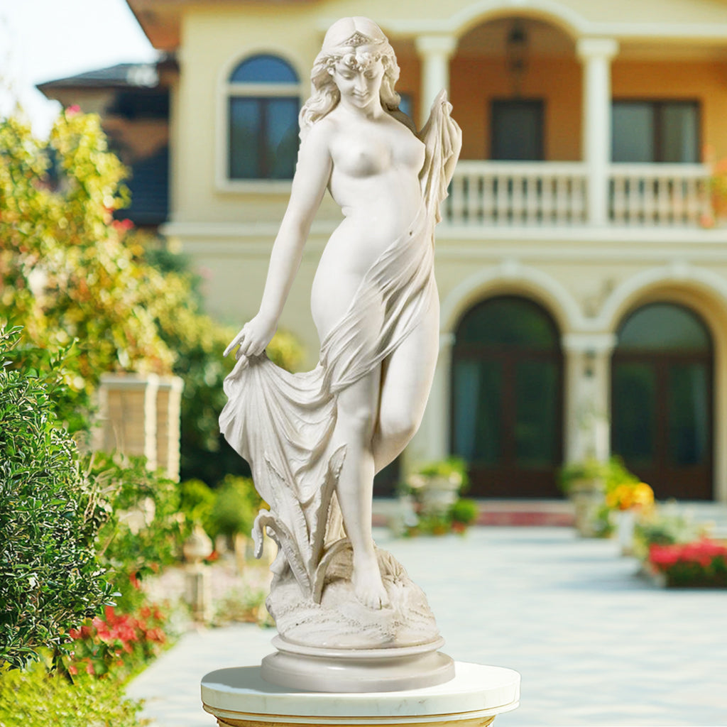 Elegant indoor white marble "The Bather" sculpture featuring a graceful lady with flowing drapery, display outdoor garden