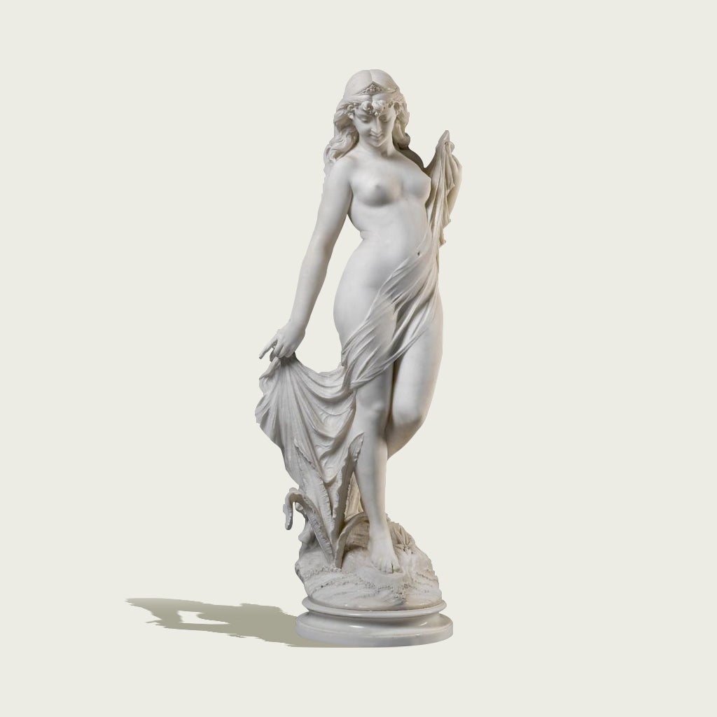 Elegant indoor white marble "The Bather" sculpture featuring a graceful lady with flowing drapery