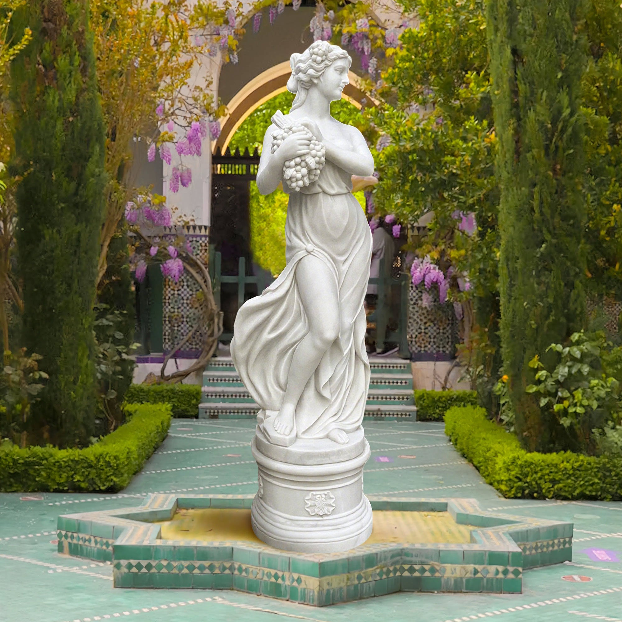 Hand-carved marble Greek Summer Goddess statue from "The Four Seasons" collection, symbolizing abundance and vitality with a graceful pose and grapes.