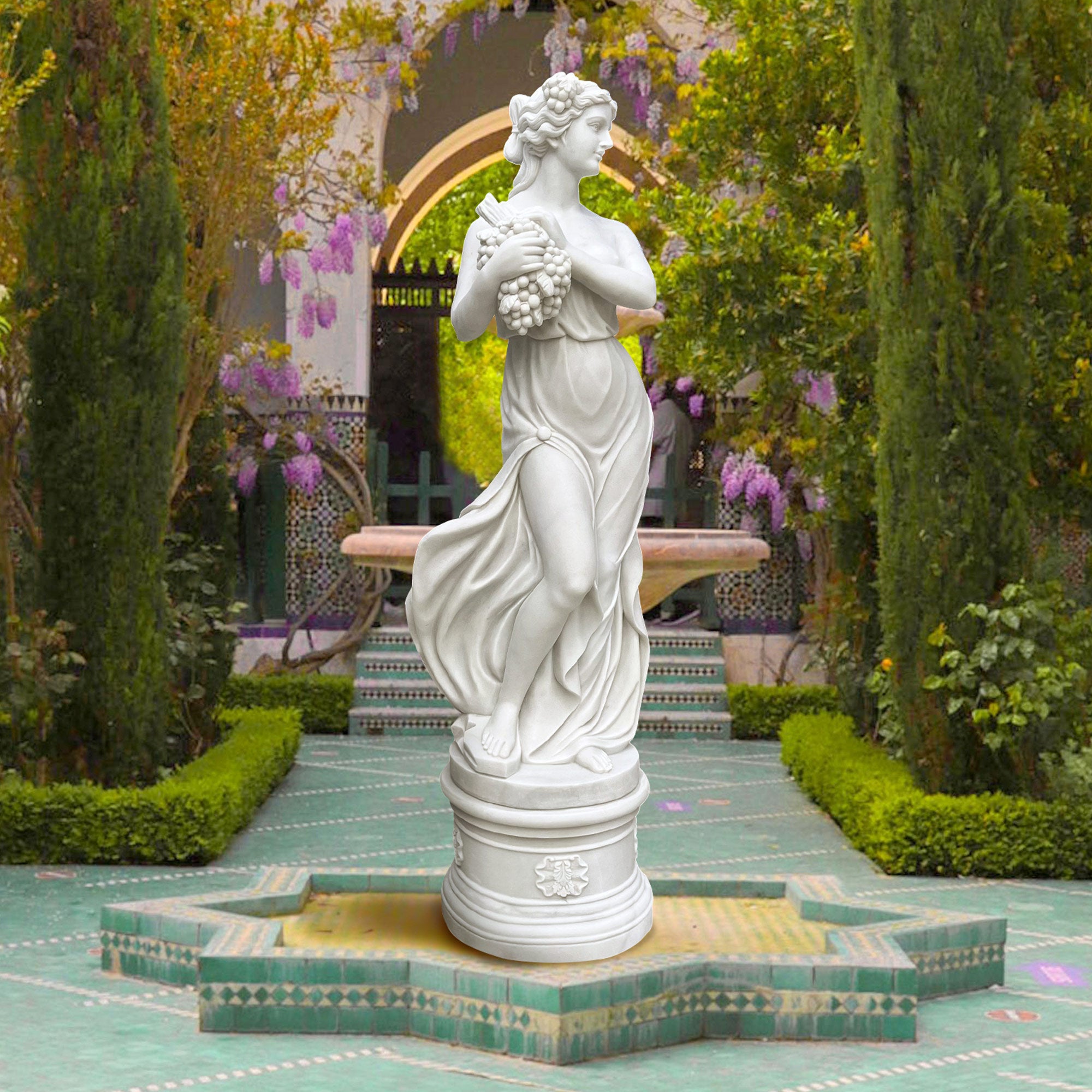 Hand-carved marble Greek Summer Goddess statue from "The Four Seasons" collection, symbolizing abundance and vitality with a graceful pose and grapes.
