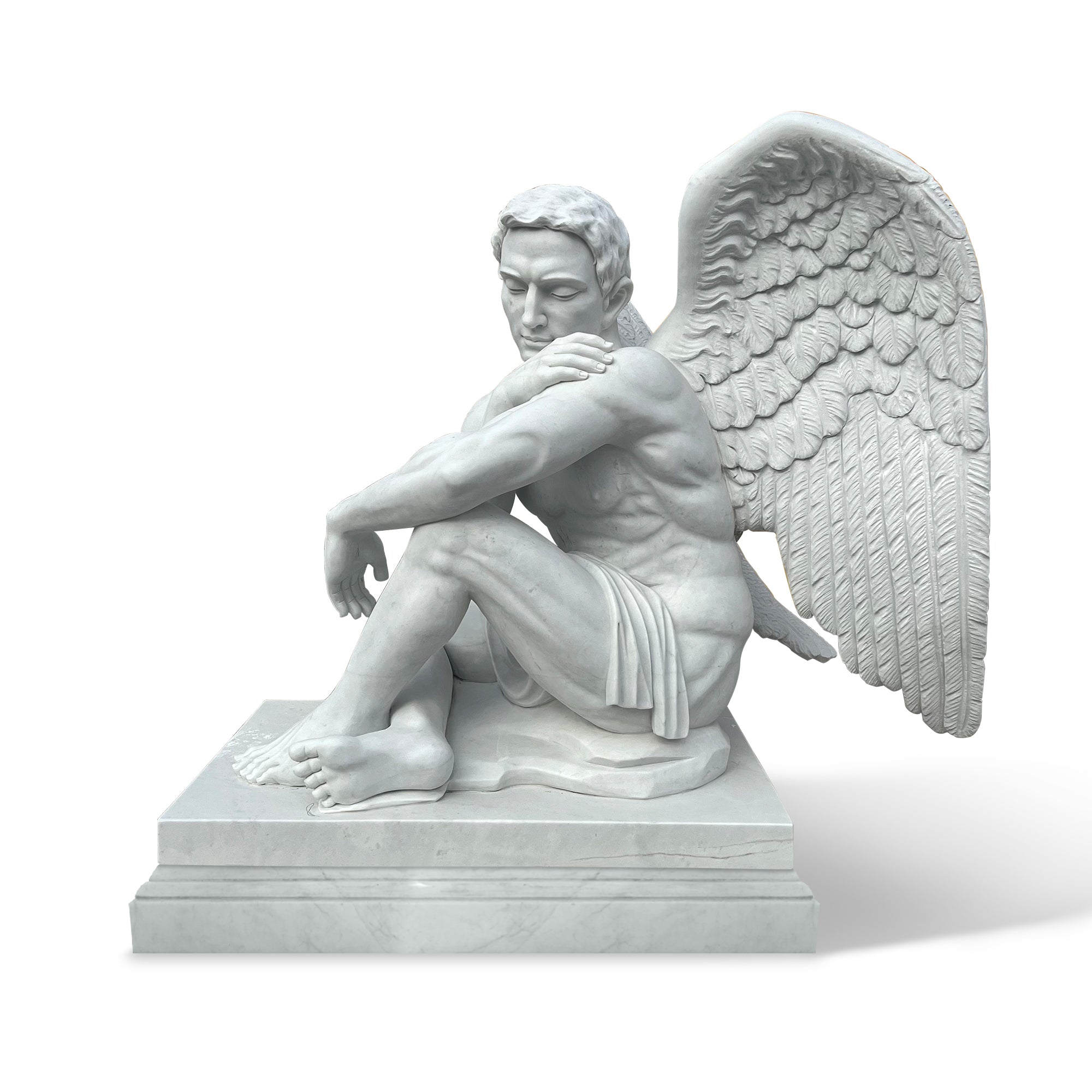 Seated male guardian angel statue hand-carved in marble with open wings and contemplative expression