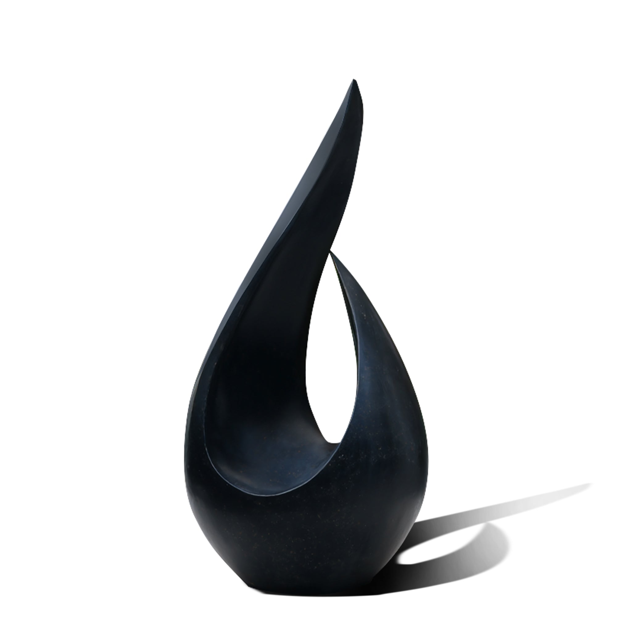 Black abstract sculpture on a white background
