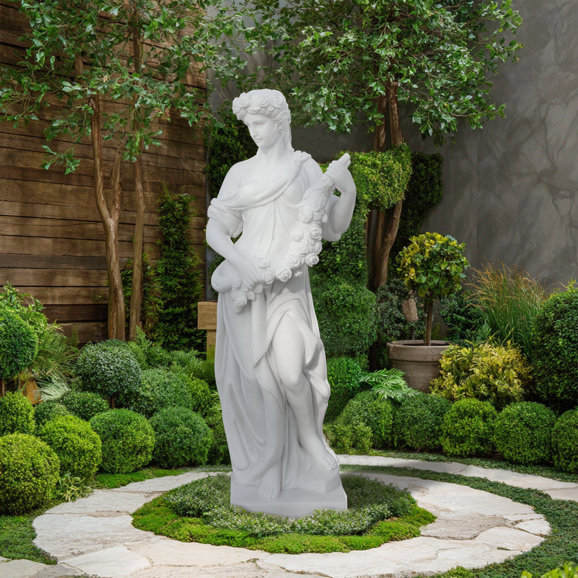 Hand-carved marble Spring statue displayed in a garden setting