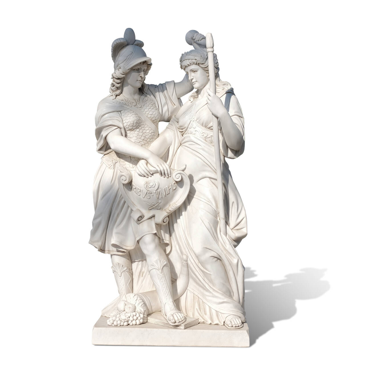 Outdoor marble sculpture showing a warrior woman in Roman armor beside a crowned female, creating a ceremonial presence for gardens or villas.