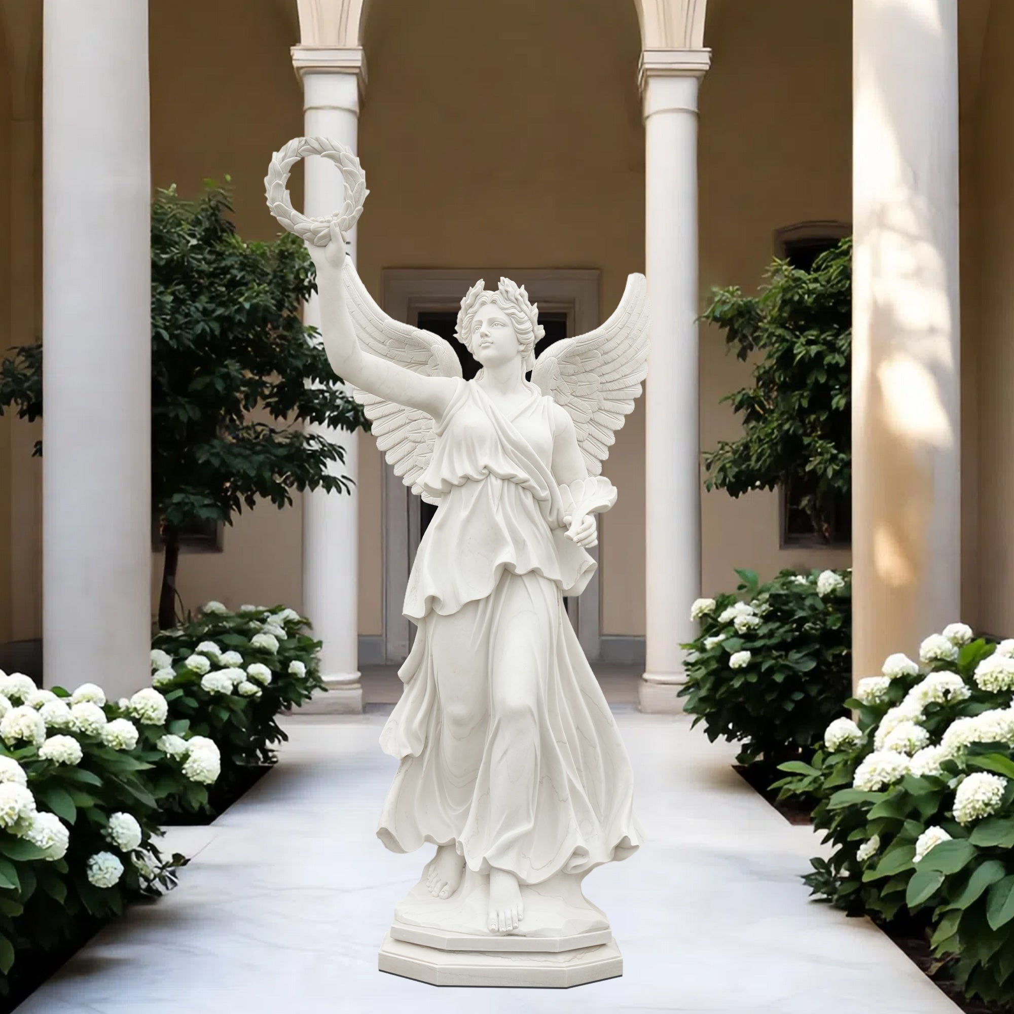Classical white marble statue of Roman goddess Victoria with laurel wreath, displayed in luxury courtyard garden