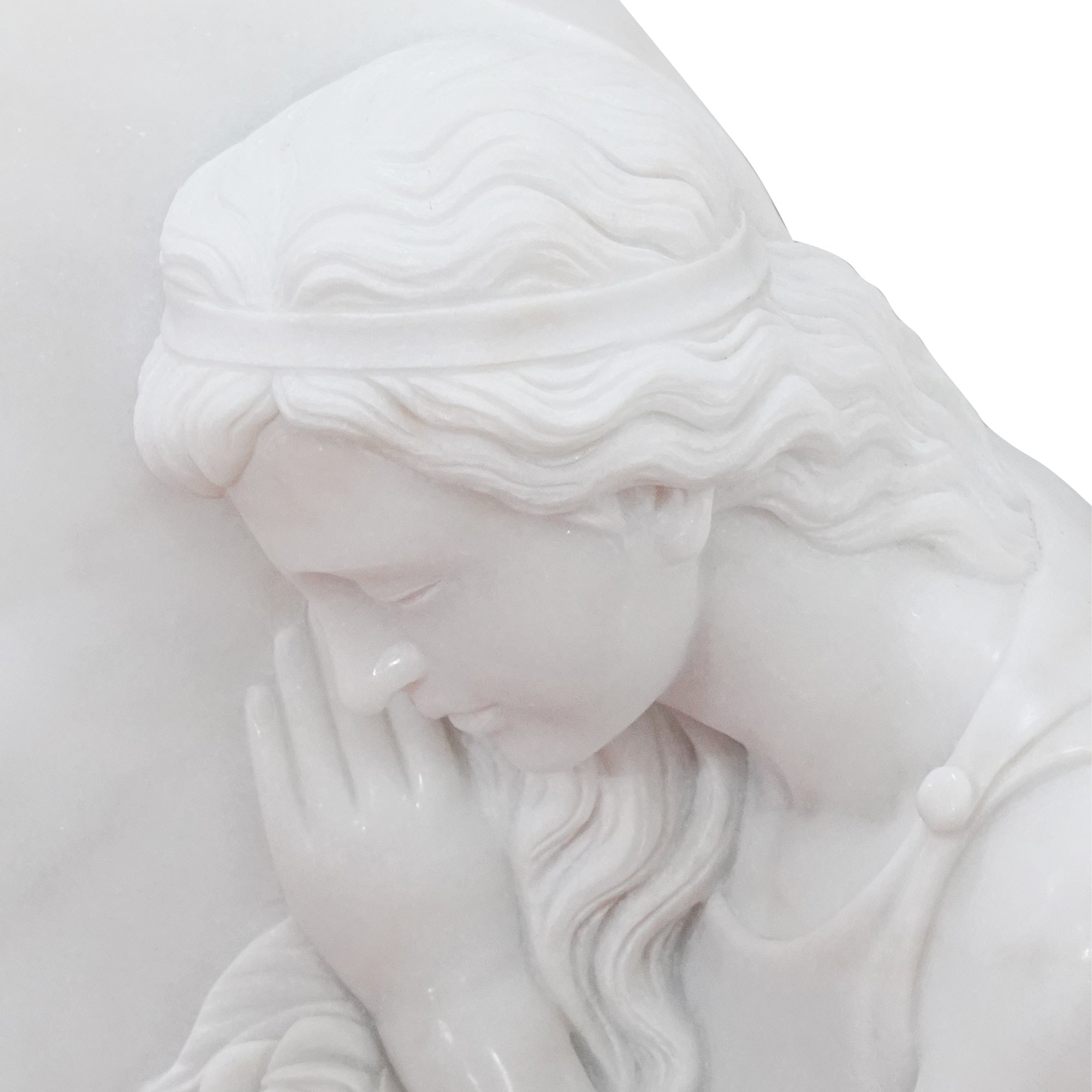 carved marble angel headstone face detail with serene expression and peaceful gesture