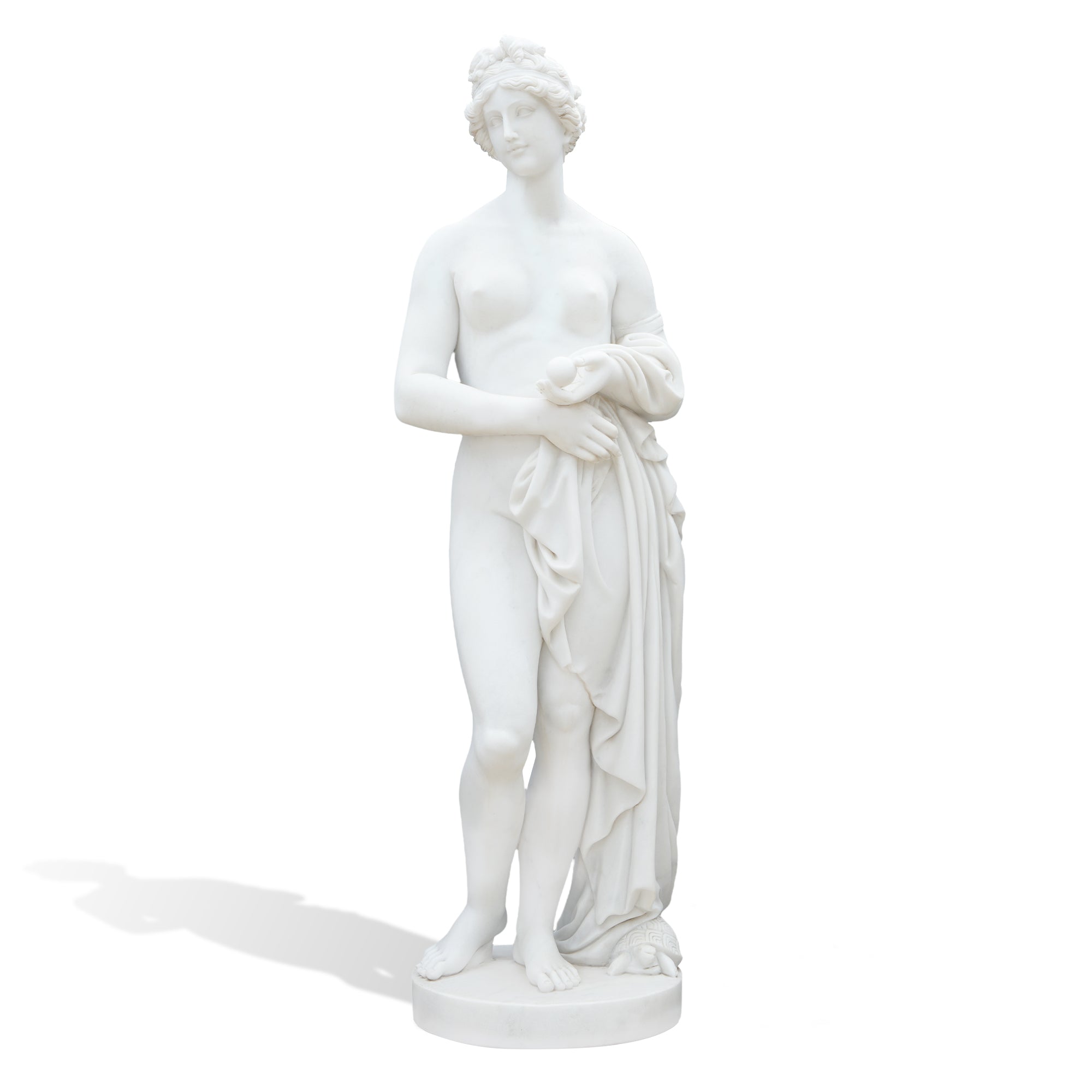 A contemporary marble replica of the ancient Aphrodite of Knidos, shown as a full-height goddess figure holding softly carved drapery.