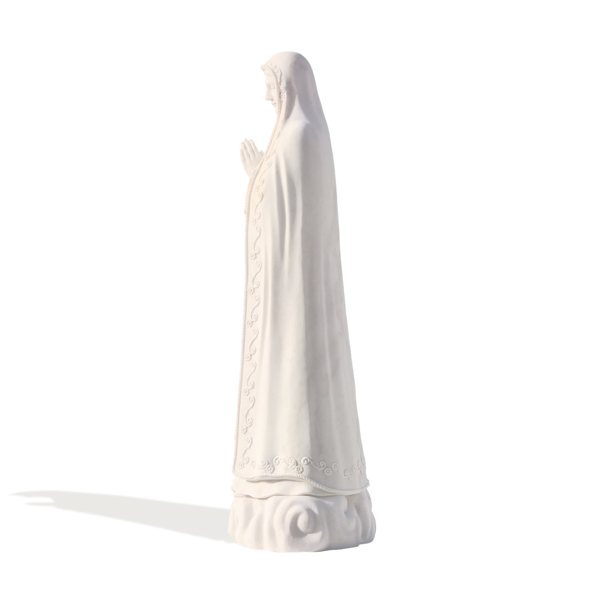 Elegant side-angle view of hand-carved marble Our Lady of Fatima statue, showcasing flowing robe details and serene craftsmanship for church and chapel use.