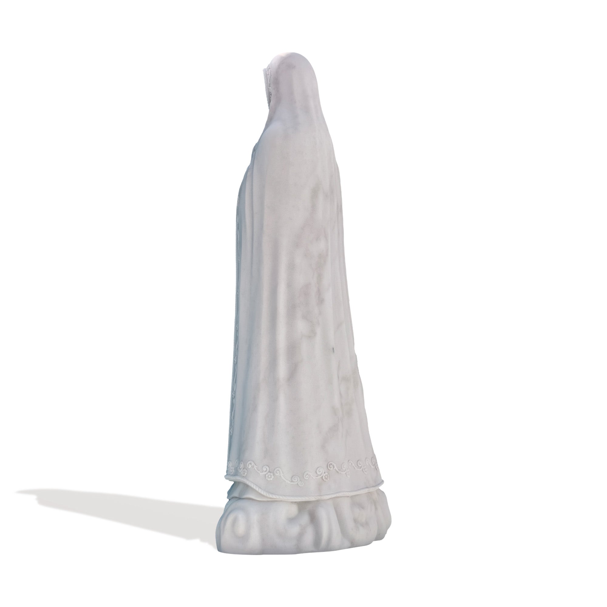 Rear view of handcrafted marble religious statue depicting Our Lady of Fatima, elegant sacred art piece for church interiors or gardens.