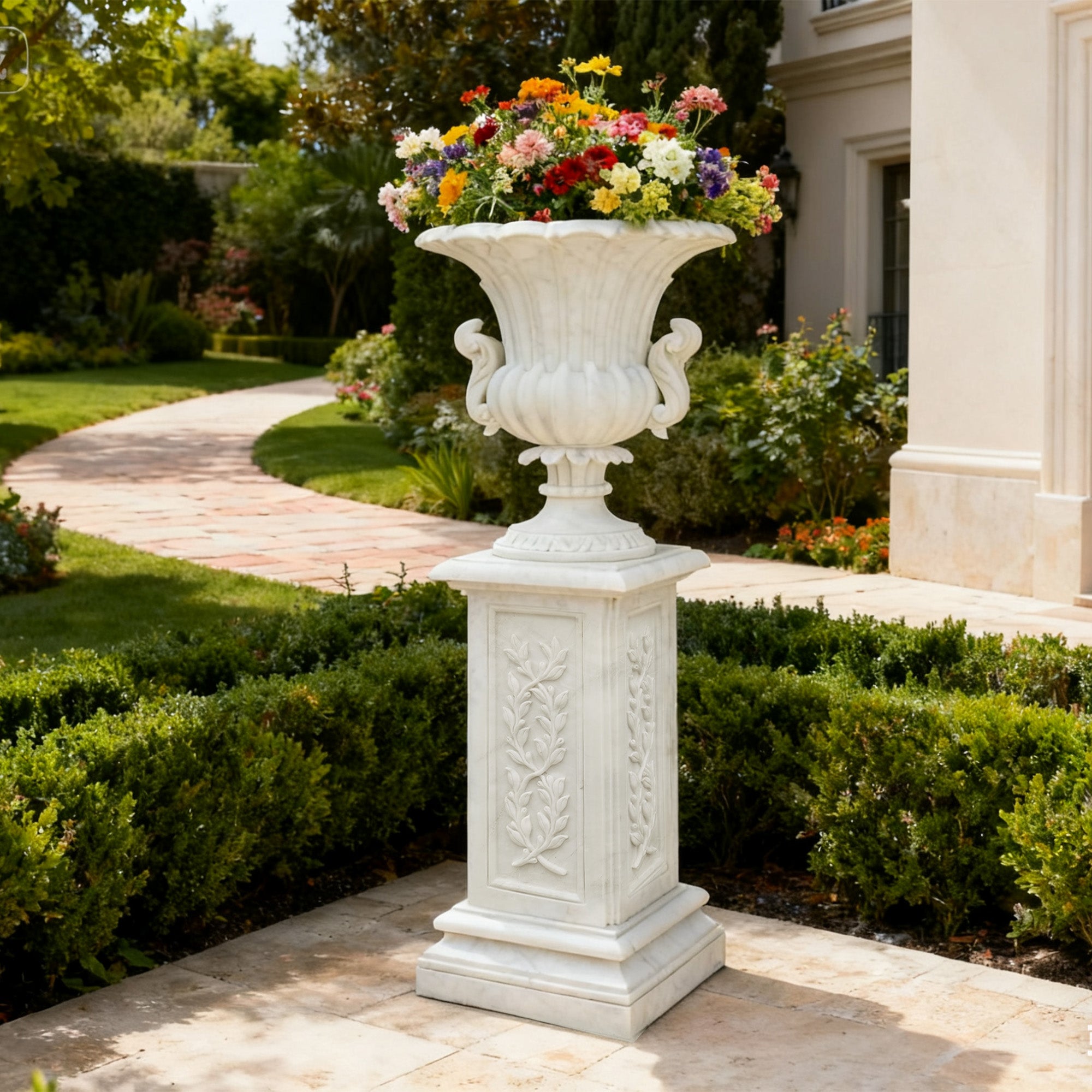 Classic white marble flower vase with ornate carvings and elegant design, ideal for enhancing garden landscapes and luxurious outdoor spaces.