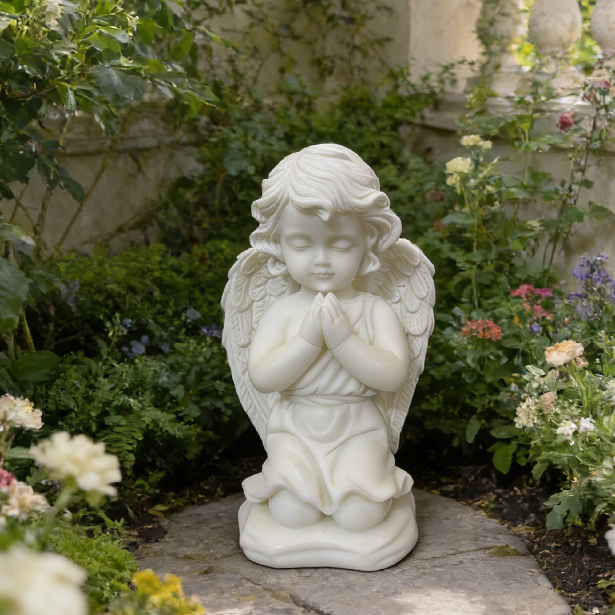 white marble praying angel garden statue outdoor, kneeling cherub sculpture placed in flower garden, decorative memorial angel for yard and patio