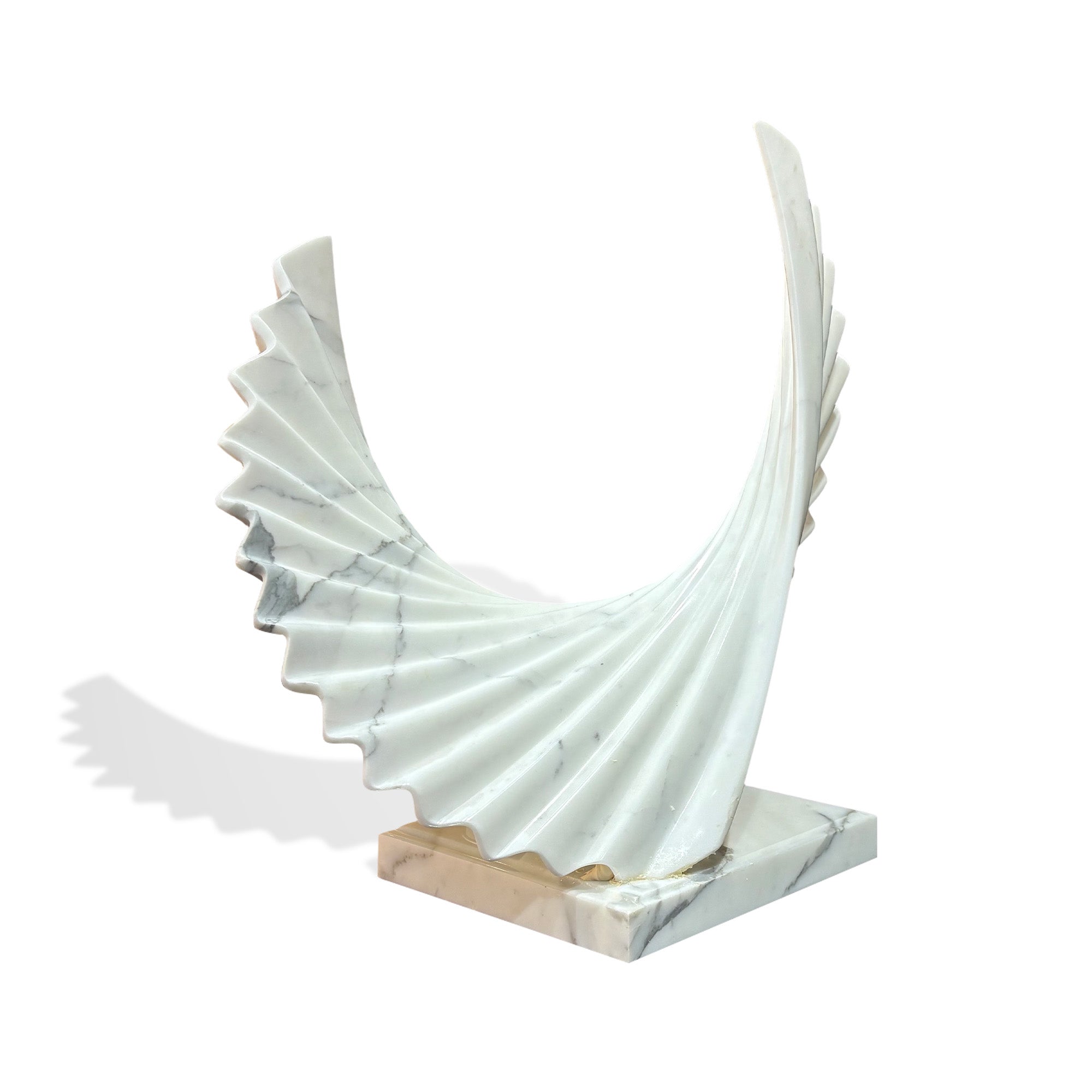 Carrara marble fan form sculpture in angled view, modern abstract stone artwork with flowing carved lines