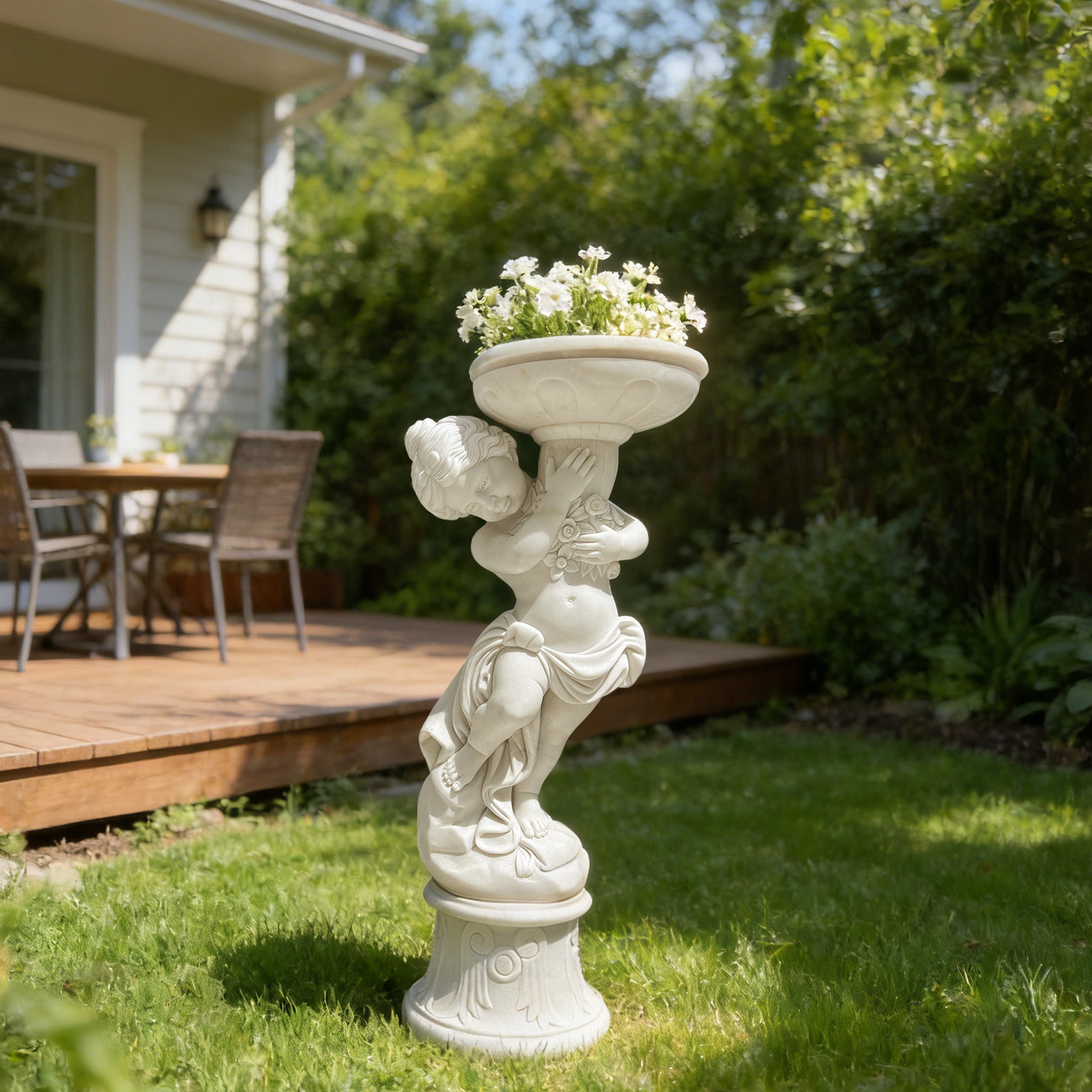 Marble child sculpture holding a plant pot in a lush garden, adding charm to outdoor living spaces.