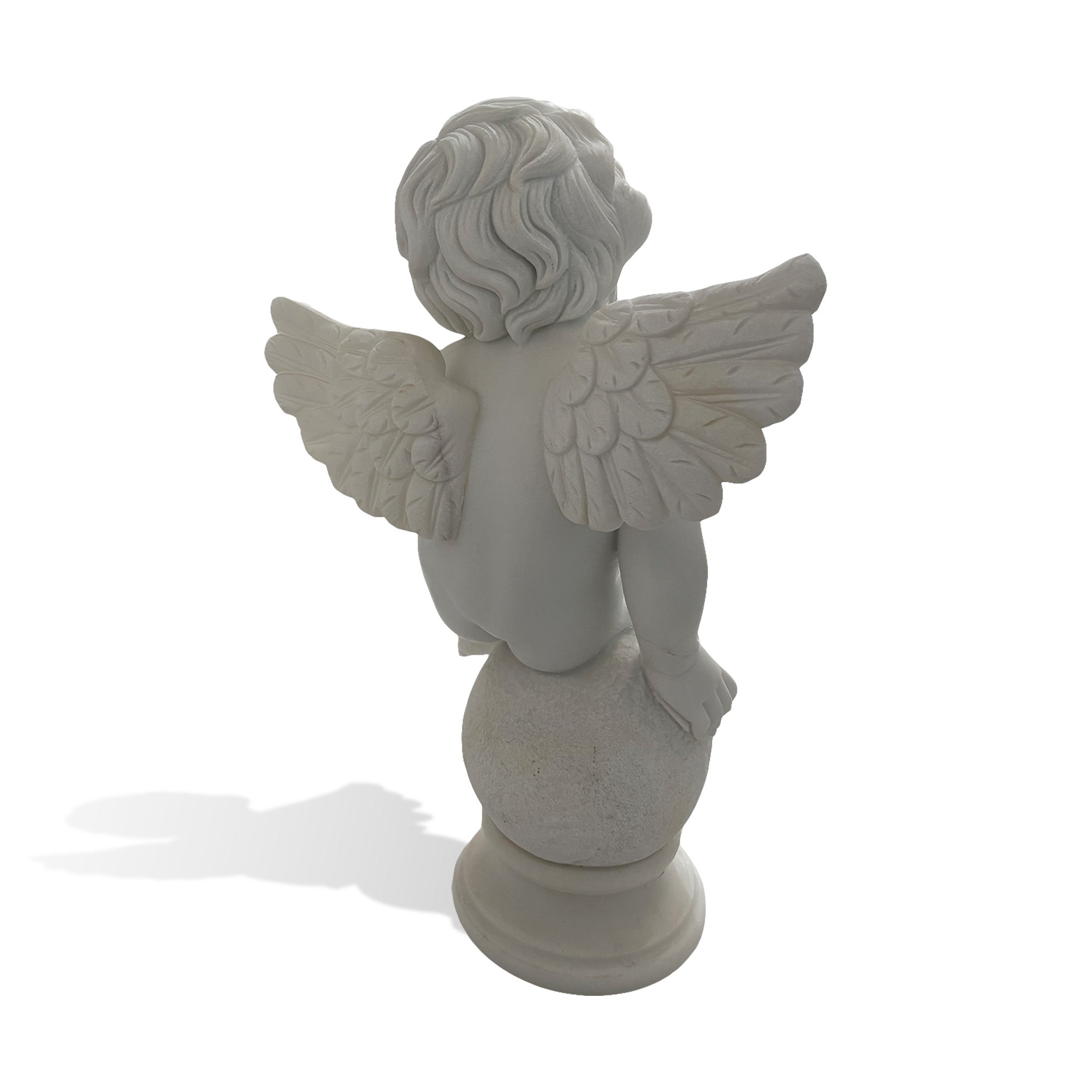 Back view of white marble cherub angel statue with carved wings and detailed hair for luxury garden patio and villa decor