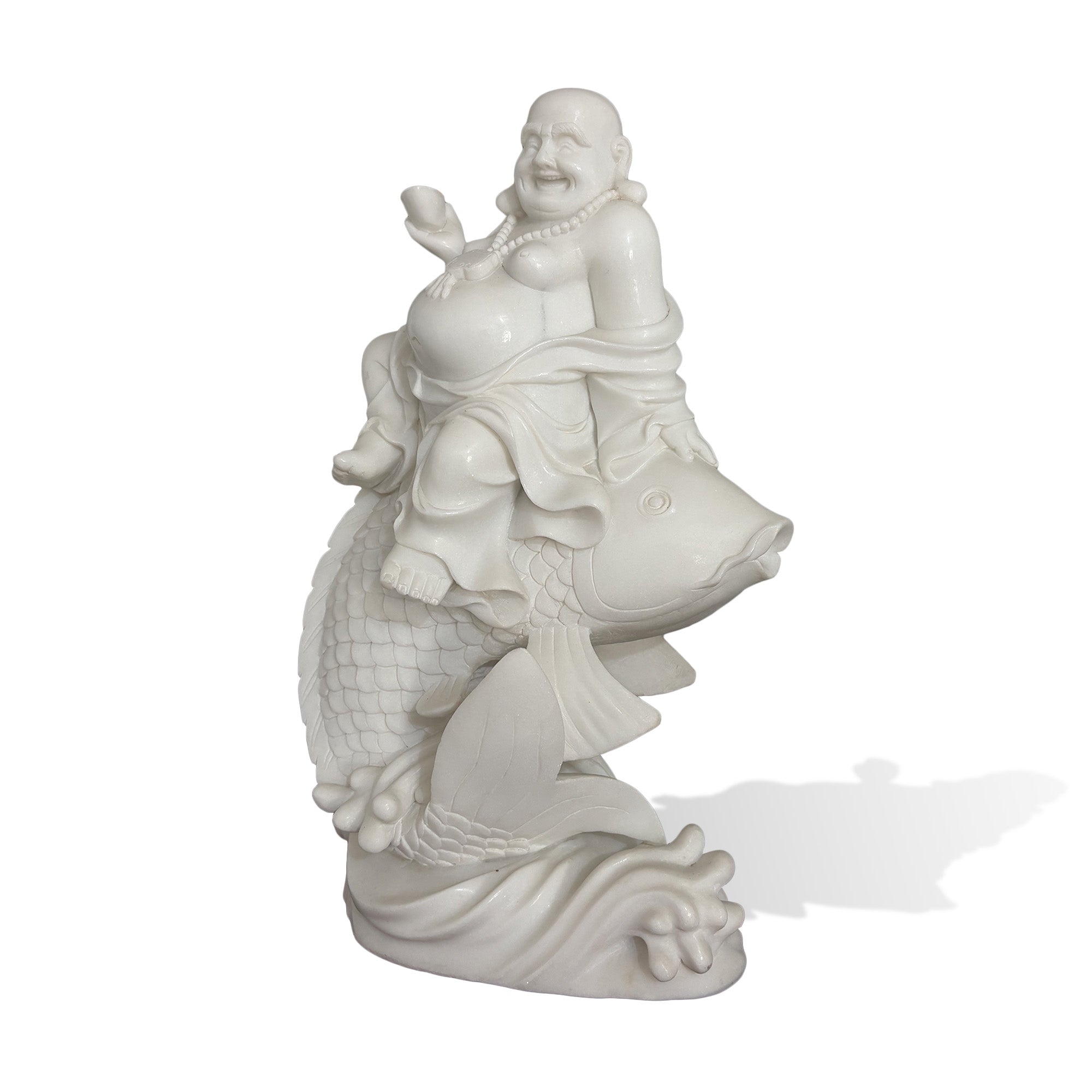 Front view of a natural white marble Laughing Buddha riding a koi fish with a wealth ingot and carved wave base