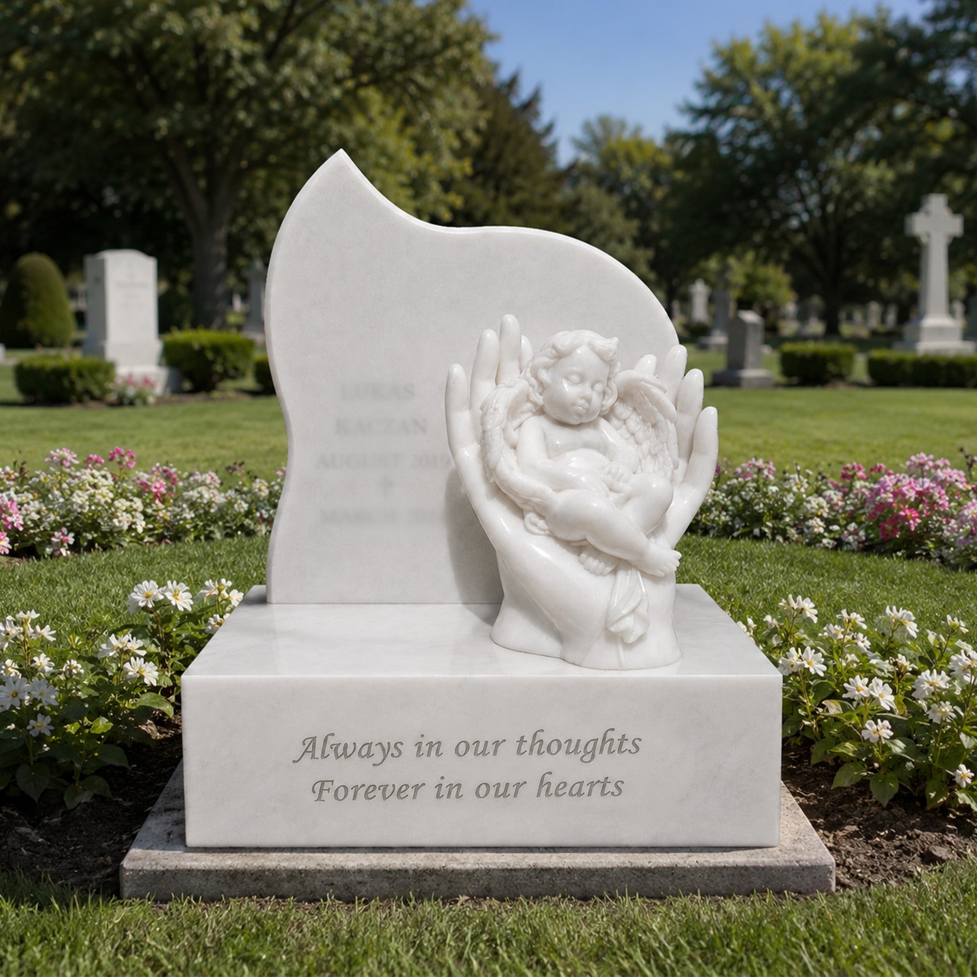 White marble sleeping angel child memorial headstone displayed in a cemetery garden, featuring a baby angel resting in guardian hands for a peaceful remembrance grave