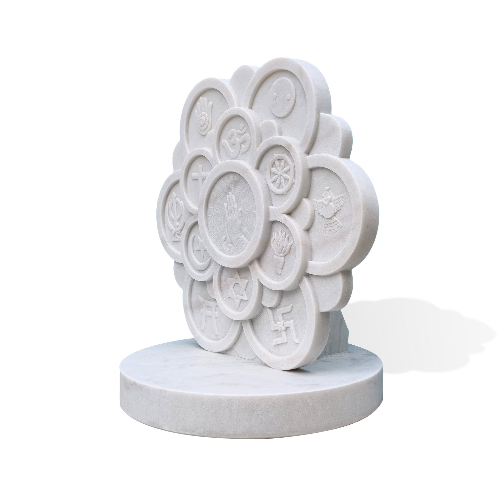 Side view of Unity Bloom marble interfaith sculpture showing thick carved relief structure, layered religious symbol panels, round marble base, and white background