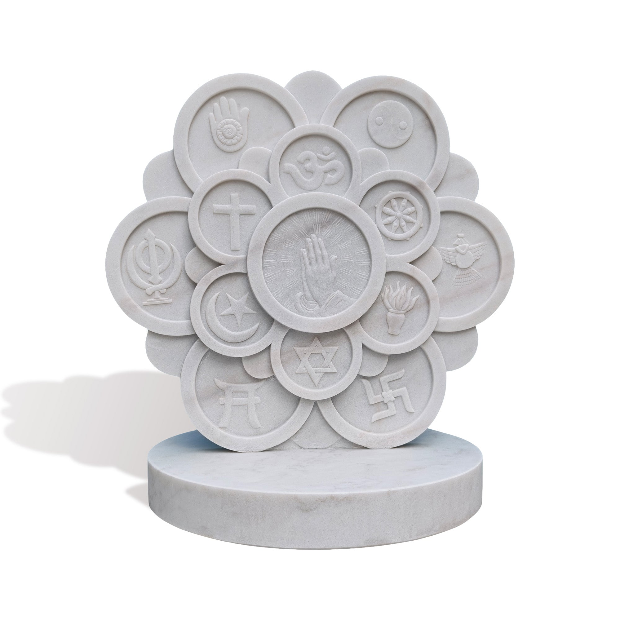 White marble multi-faith relief monument featuring layered circular panels, world religions symbols, central prayer hand design, carved lotus-like form, and round base on white background