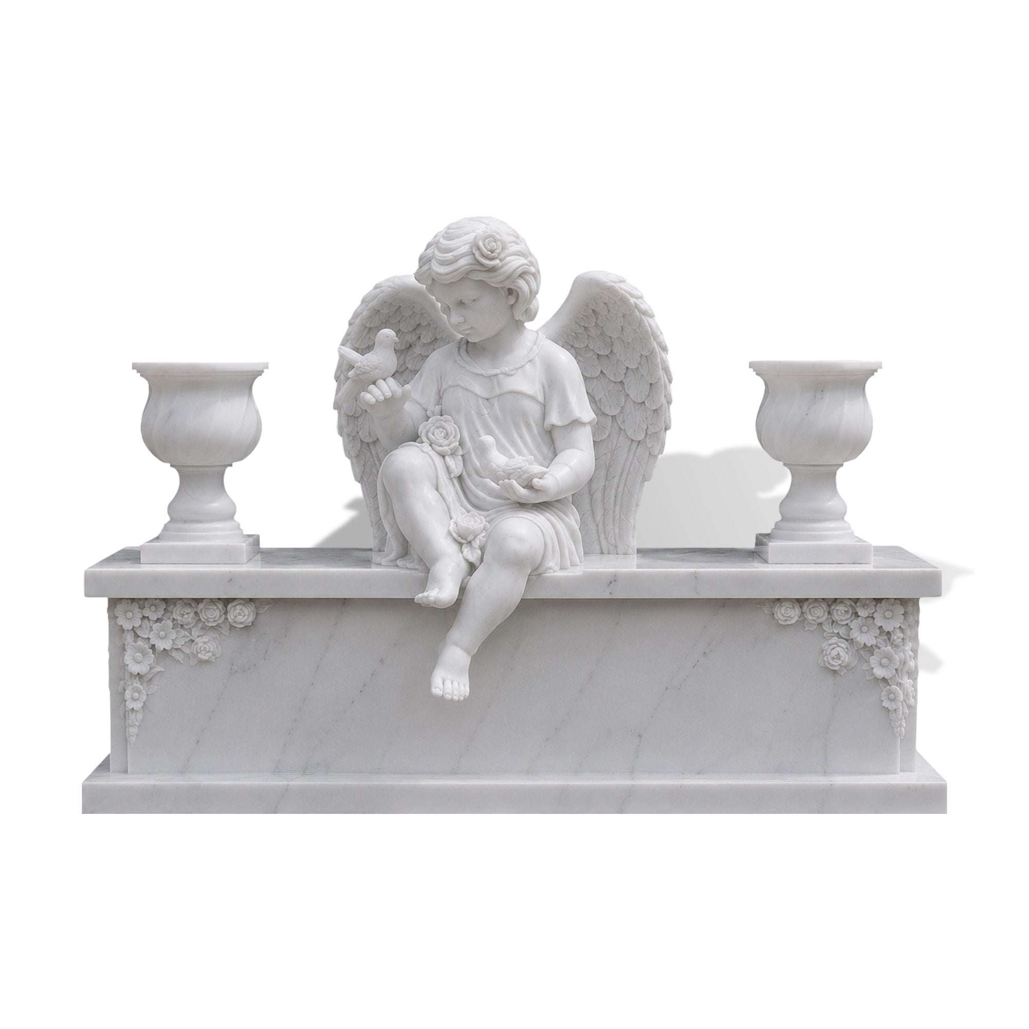 White marble angel cemetery memorial sculpture with wings, flowers, and carved memorial tablet