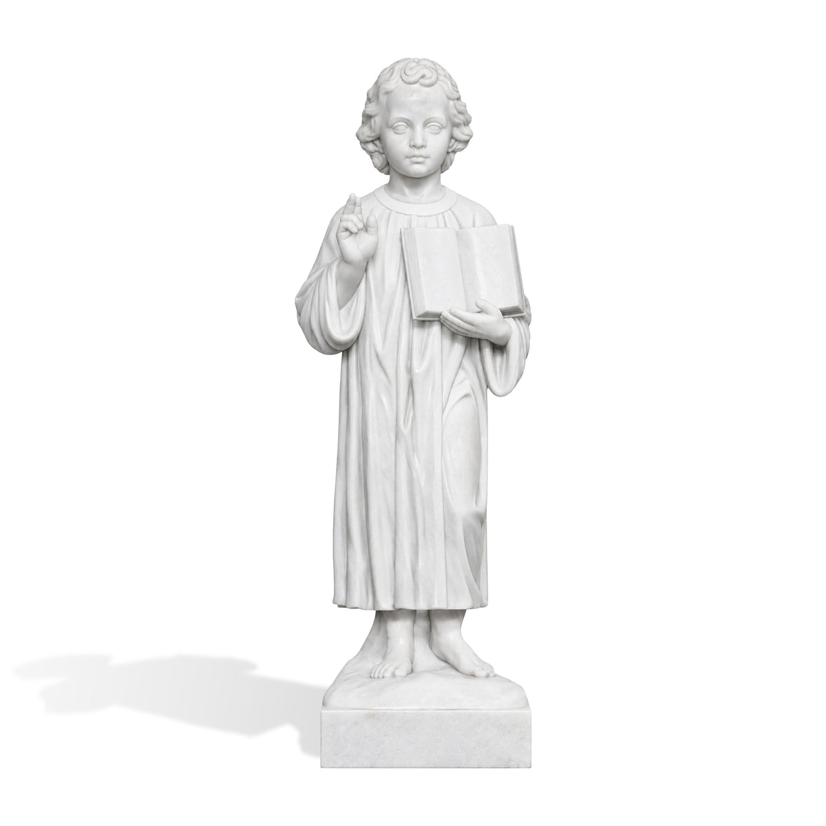 Hand-carved white marble Child Jesus religious statue featuring curly hair, a full-length draped robe, bare feet, an open book held against the chest, and a raised right hand giving a blessing.