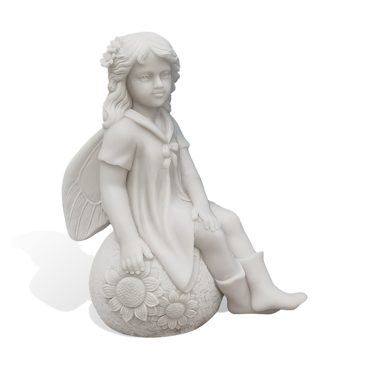Hand-carved white marble fairy girl statue with detailed wings, flowing hair, a short dress and boots, seated on a rounded base decorated with two sunflowers.